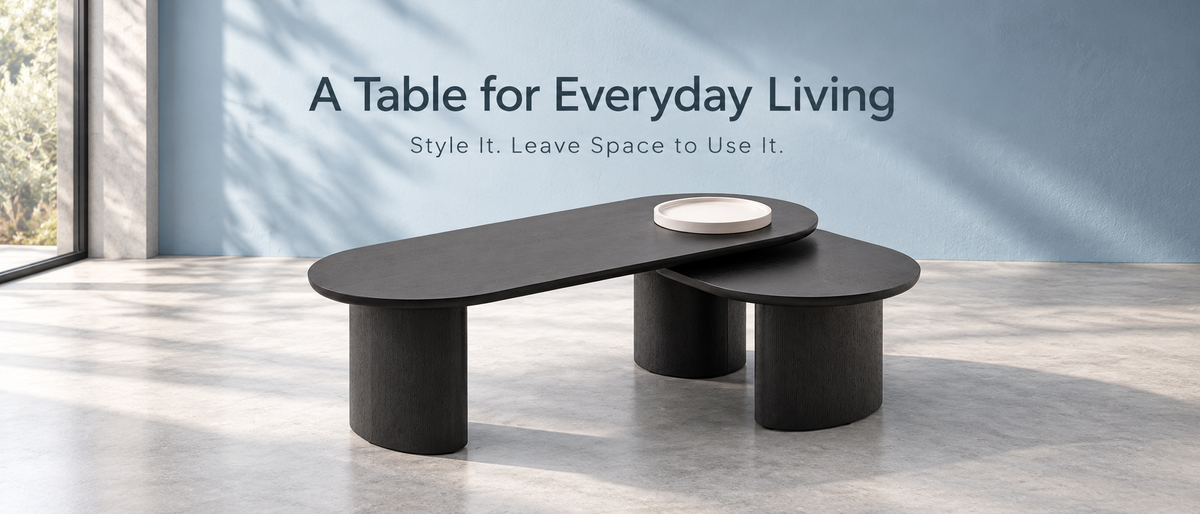 Adwin black Ashley coffee table with its pale tray in a softly lit gallery setting beneath A Table for Everyday Living.