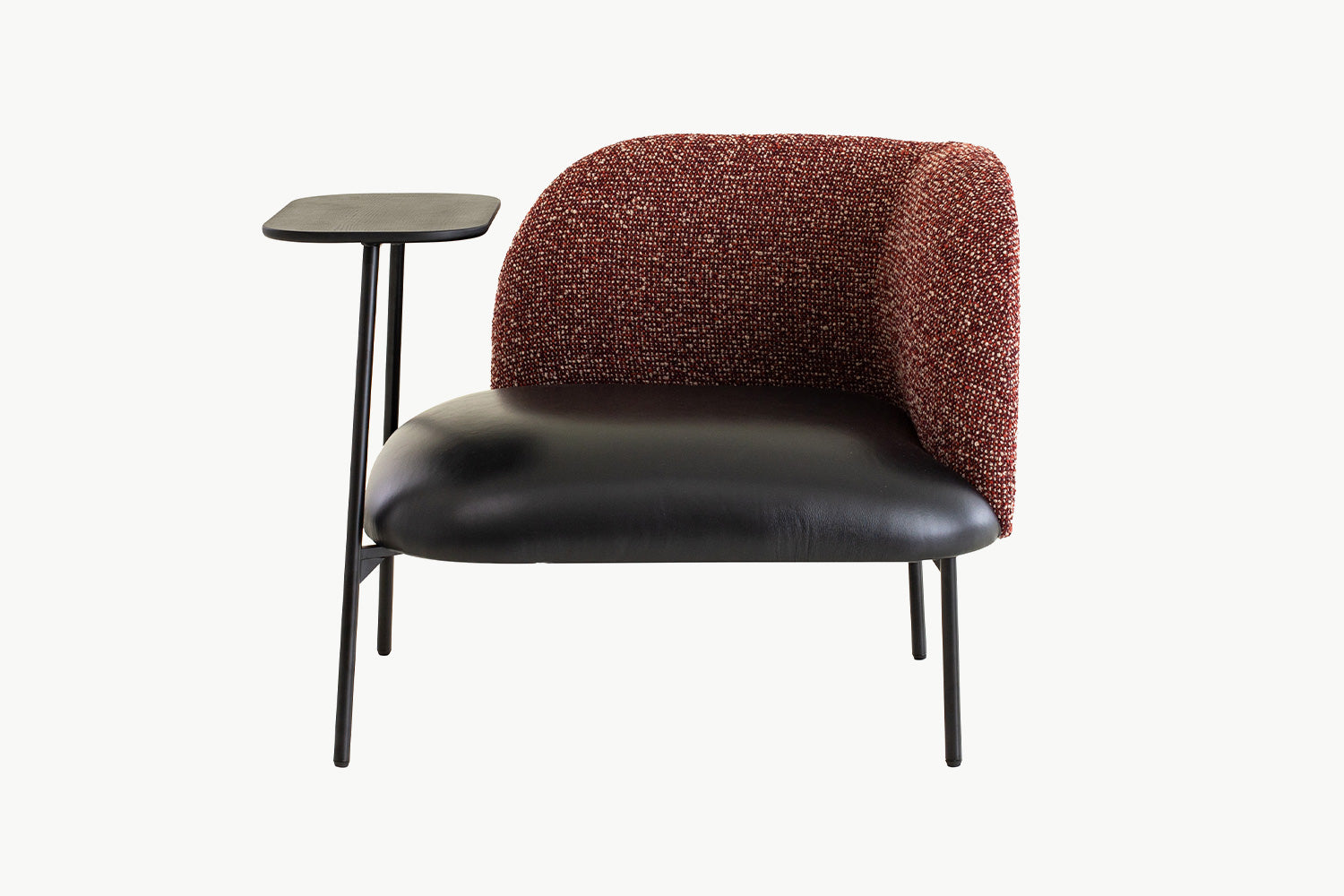 Modern Angela Armchair with curved high backrest in rich textured bouclé fabric and sleek black leather seat