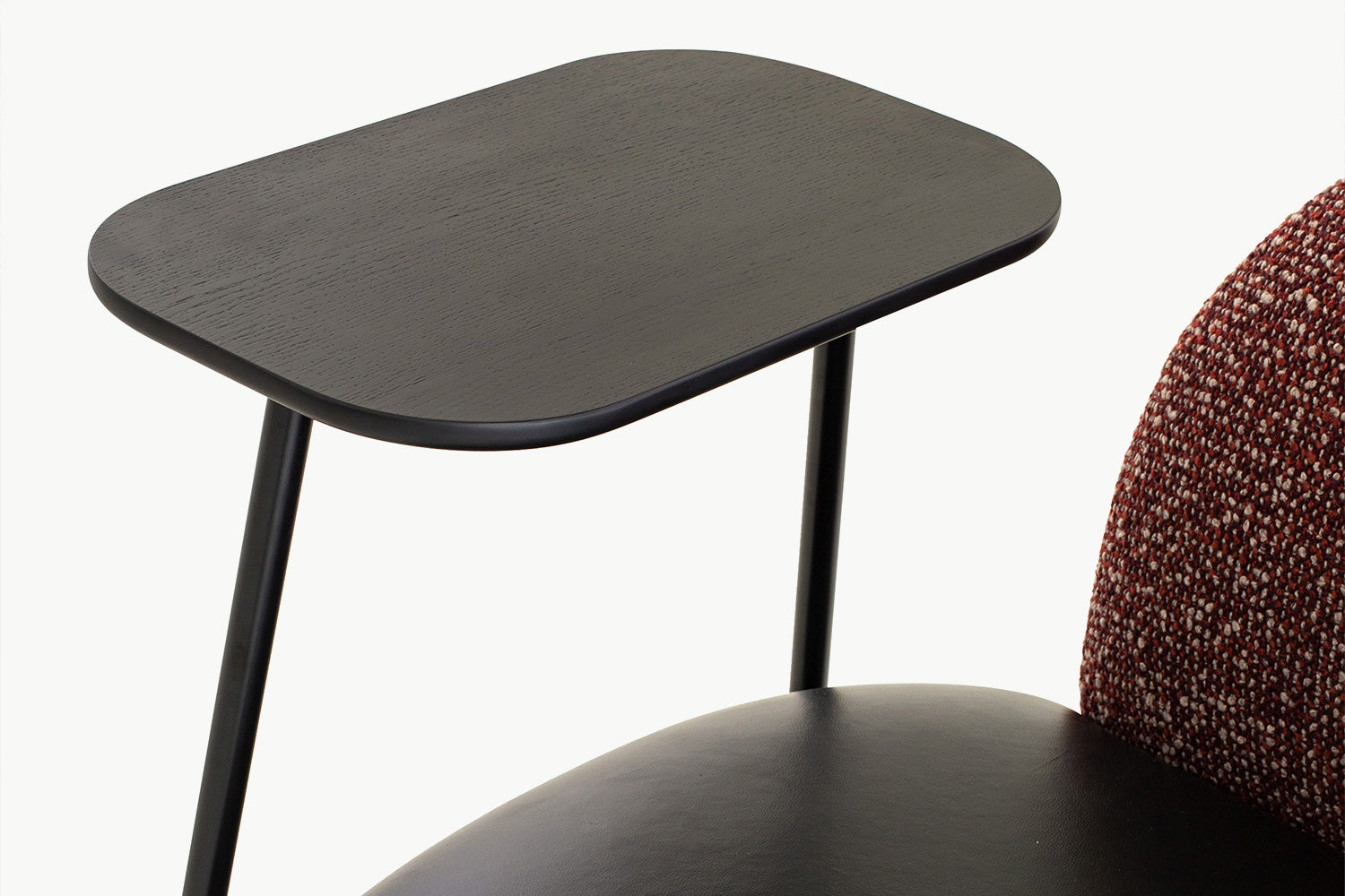 Close-up of the smooth black leather seat cushion on the Angela Armchair, offering premium comfort and easy maintenance