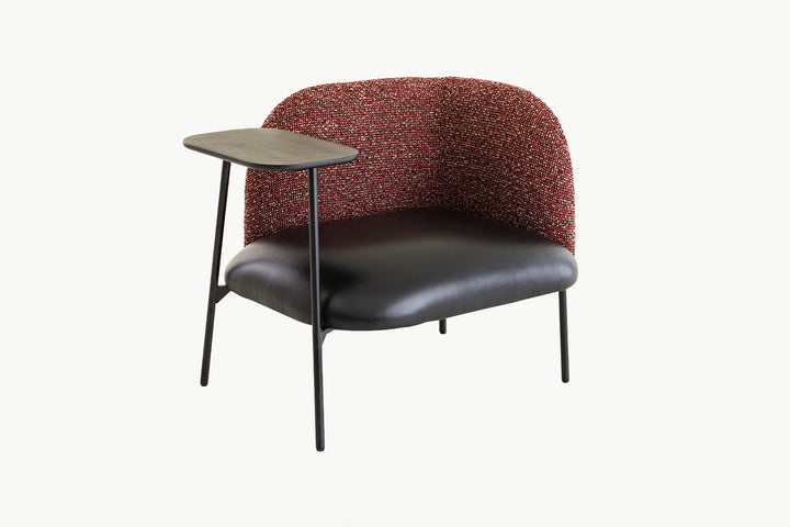 Back view of the Angela Armchair highlighting the generous rounded bouclé backrest and clean metal frame design
