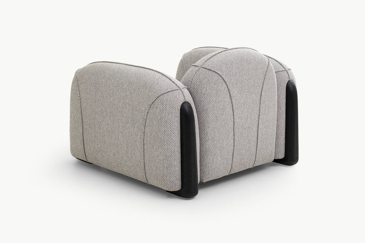 Side view of Chirs Sofa 1-seater boucle with scalloped back and dark wood base