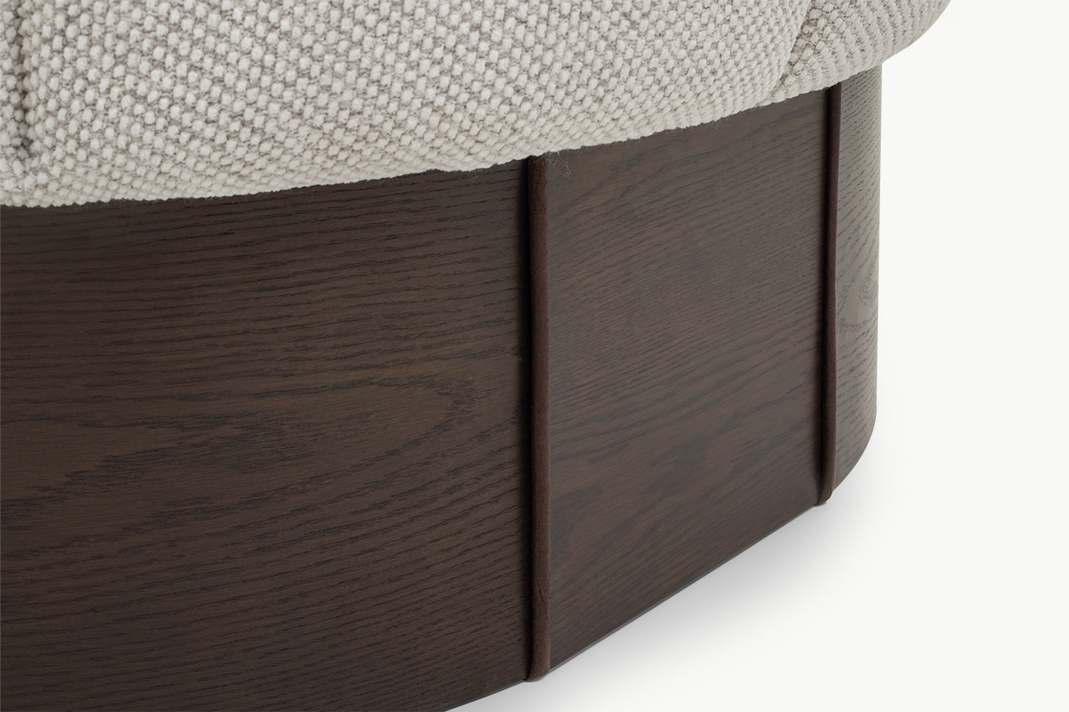 Dark walnut base and boucle edge detail on Chloe 1-seater curved sofa