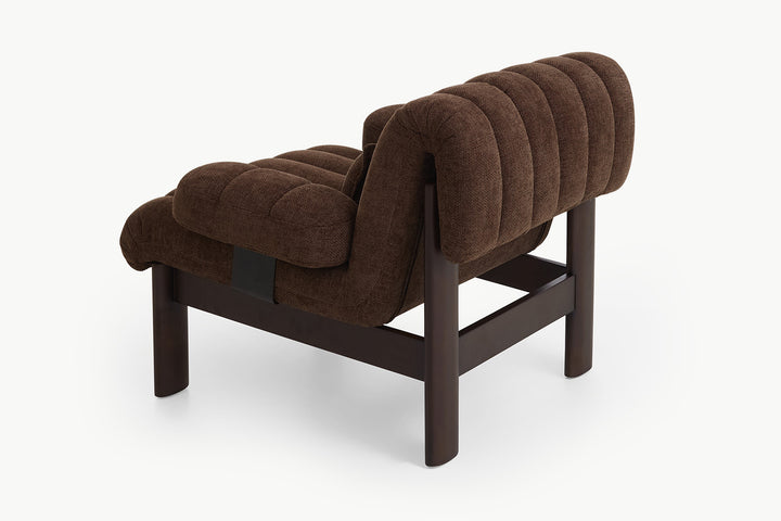 Top-down Coco Armchair, generous padded seat invites long sits, chocolate boucle softness, cozy personal sanctuary