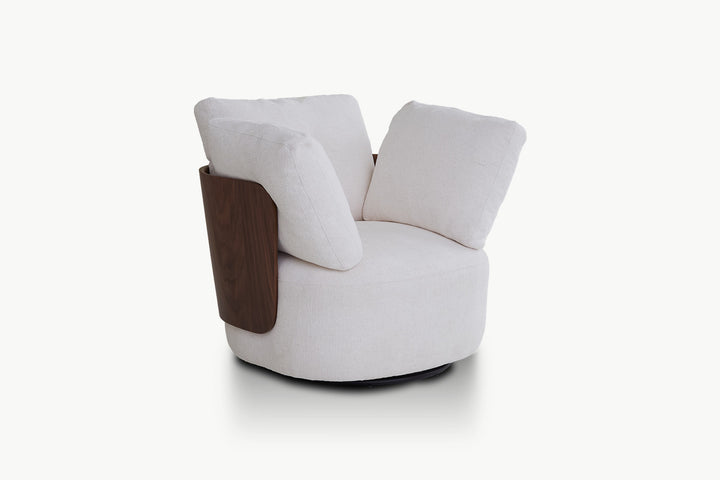 Elizabeth Leisure Chair in soft cream fabric with walnut wood arm panels and plush oversized back cushions on a 360-degree swivel base