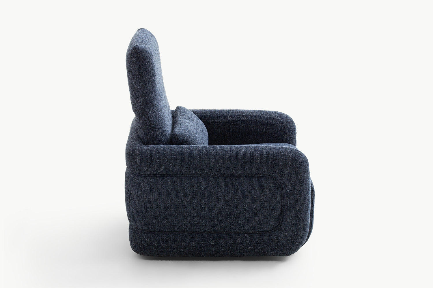 Side profile of the Emily Leisure Chair displaying its bold rounded arms and deep seat in luxurious navy blue fabric